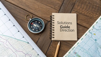 Compass on Map with Notebook for Solutions and Direction Guidance