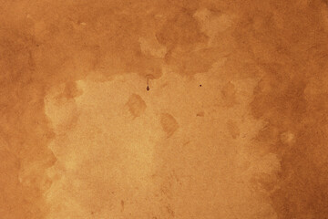 Old brown kraft parchment paper with brown stains and splatter