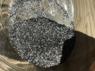 A bowl of graphite powder