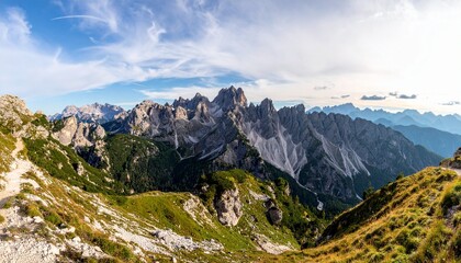 Panoramic view of snow-covered mountains at sunset, with golden light casting dramatic shadows across rugged peaks and valleys, evoking serenity, elevation, and the sublime beauty of winter.