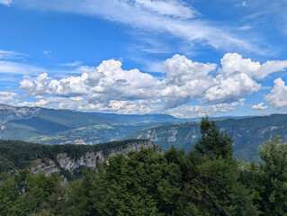 Obraz premium panoramic view of the European Alps in Northern Italy with a blue sky and white clouds