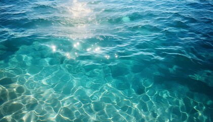 Crystal Clear Turquoise Water Surface Reflecting Sunlight Creating Mesmerizing Patterns And Textures In A Tranquil Aquatic Environment
