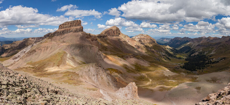 This scenic San Juan Mountain panorama features Colorado 13ers Coxcomb Peak, Redcliff, and Fortress Peak rising above the Middle Fork Cimarron River Basin.