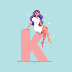 Charming Woman in a White Dress Sitting on a Large Pink Letter K with Sparkles