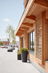 Obraz premium closeup of modern wooden facades on contemporary buildings blending historical architecture with new design