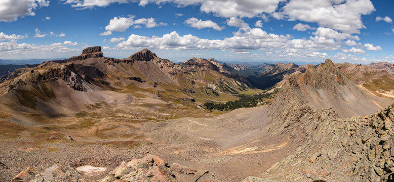 This stunning San Juan Mountain panorama features 13ers Coxcomb Peak, Redcliff, and Heisshorn rising above the scenic Cimarron River Basin.