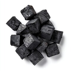 Dark, square, charcoal-like pieces clustered together