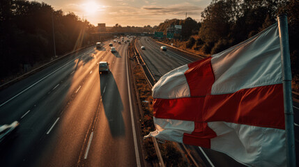 England St George&rsquo;s Cross flag over UK motorway showing patriotism and political debate