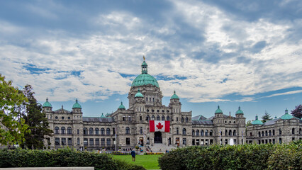 Victoria, BC, Canada - August 29, 2025: Victoria parliament building features grand stone architecture, copper domes while inside showcases elegant chambers, stained-glass windows, and historic art © Deyao
