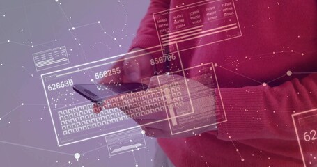 Holding tablet, man wearing red sweater manipulating holographic panels at studio, copy space