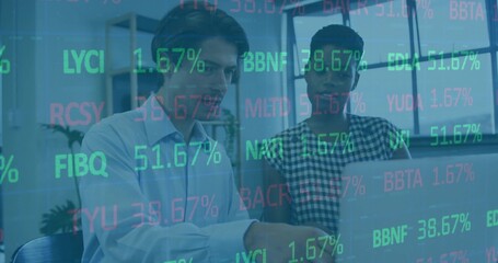 Collaborating colleagues in business casual analyzing numbers on laptop with floating codes overlay