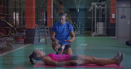 Blue-shirted trainer stretching client's leg on pink mat in gym, with line-graph overlays
