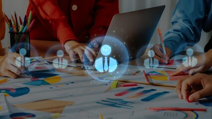 A dynamic office scene featuring a collaborative business meeting with a laptop, colorful charts, and engaged team members, fostering creativity and strategic planning. Raster