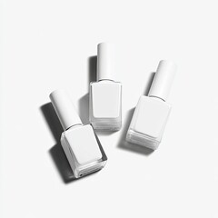 Three white nail polish bottles arranged on a plain white background