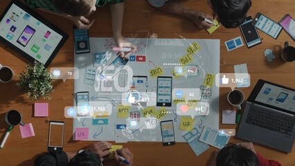 A collaborative workspace showing a team of professionals engaged in a digital strategy session. They use mobile devices and notes for effective planning and brainstorming. Raster