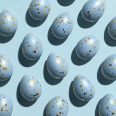 Light-blue eggs, speckled with gold, arranged in a grid pattern on a pale blue surface