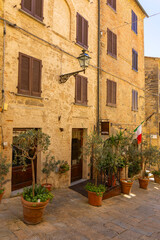 Charming Hotel in Tuscany with Potted Plants and Italian Flag