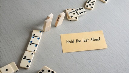 Dramatic Dominoes Setup with Message "Hold the Last Stand"