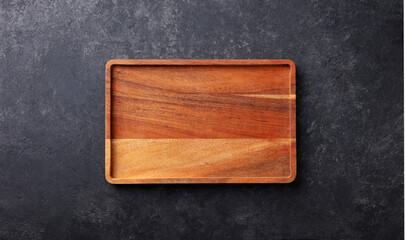 Wooden cutting board. Dark grey background. Copy space. Top view.