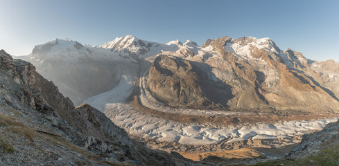 Majestic mountain landscape at sunrise showcasing breathtaking glaciers and rugged terrain in the Alps