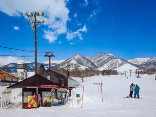 A wide view of the ski slopes with chairlifts and gondolas at Tsugaike Mountain Resort (Hakuba, Nagano, Japan)