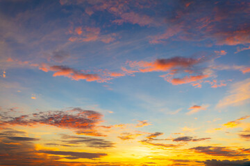 Fototapeta premium Orange and pink clouds and sky in the morning,colorful clouds and sky,Dusk, Sunset Sky Clouds in the Evening with colorful Orange, Yellow, Pink and red sunlight and Dramatic storm clouds on Twilight.