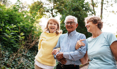 Joyful Moments Seniors Relishing a Beautiful Day Together in the Embrace of Nature