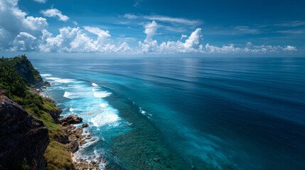 "Ocean view from elevated point with clear blue sky and calm sea in the background