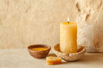 Beeswax candle and honeycomb rustic still life
