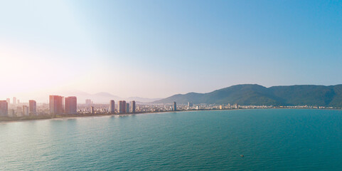 Aerial view of Da nang Vietnam coastal cityscape with ocean and mountains