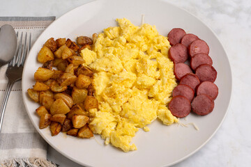 scramble eggs  with kielbasa and home fries