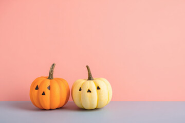 Happy Halloween message, Pumpkin on pastel paper background.
