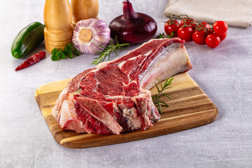 Raw prime beef steak with bone