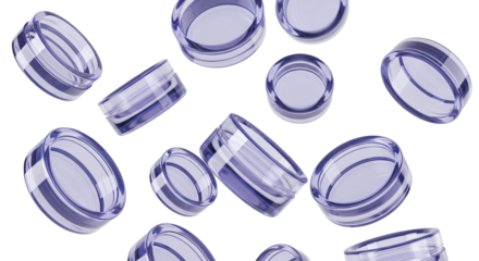 Several small, empty, clear plastic cosmetic containers with purple tinted lids are arranged on a white background.