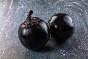 Raw round black big eggplant