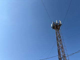 Telecommunication Tower Against a Clear Blue Sky