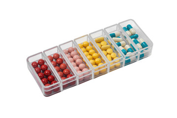 A transparent pill organizer with various colored pills and capsules, neatly arranged in compartments against a transparent background. background removed
