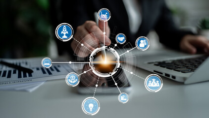 A business professional engages with a digital tool, surrounded by icons representing technology...