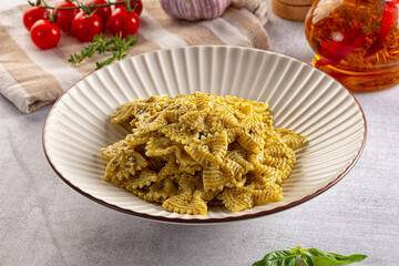 Italian green pasta farfalle with pesto