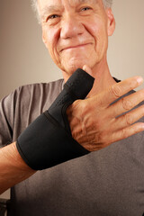 Man wearing a Black Wrist and Thumb support Brace for Arthritis and Thumb pain