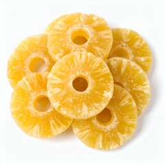 Arrangement of multiple candied pineapple rings with central voids, showcasing texture on white background
