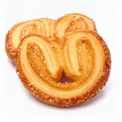 Delicate palmier pastry arrangement, featuring flaky layers and golden hue on white background
