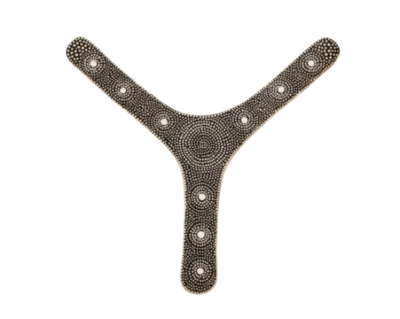 Intricate dot art adorns an aboriginal boomerang in a studio shot offering a detailed perspective