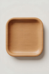 Empty light beige square wooden dish.
