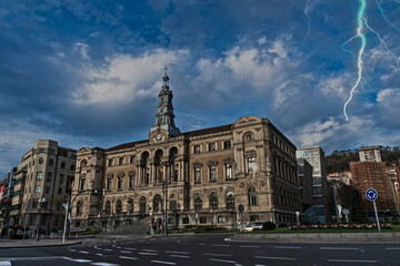 Fototapeta premium Bilbao City Hall under storm clouds and lightning.