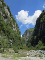 Scenic valley with green trees and blue sky in summer  