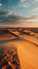 Desert landscape at sunset with rolling sand dunes