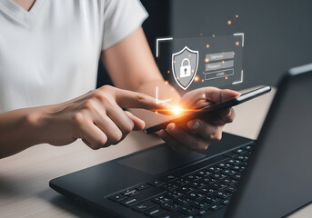 Person using smartphone and laptop with digital security interface and padlock icon, cybersecurity concept