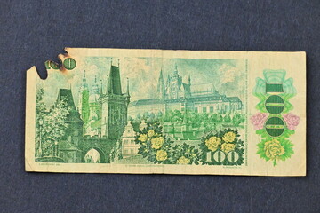 Photo of an old and damaged 100 CZK banknote from the defunct country of Czechoslovakia. Suitable...