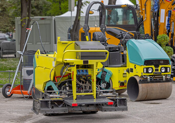 Small Surface Finisher Mini Paving Machine and Roller at Road Construction Site